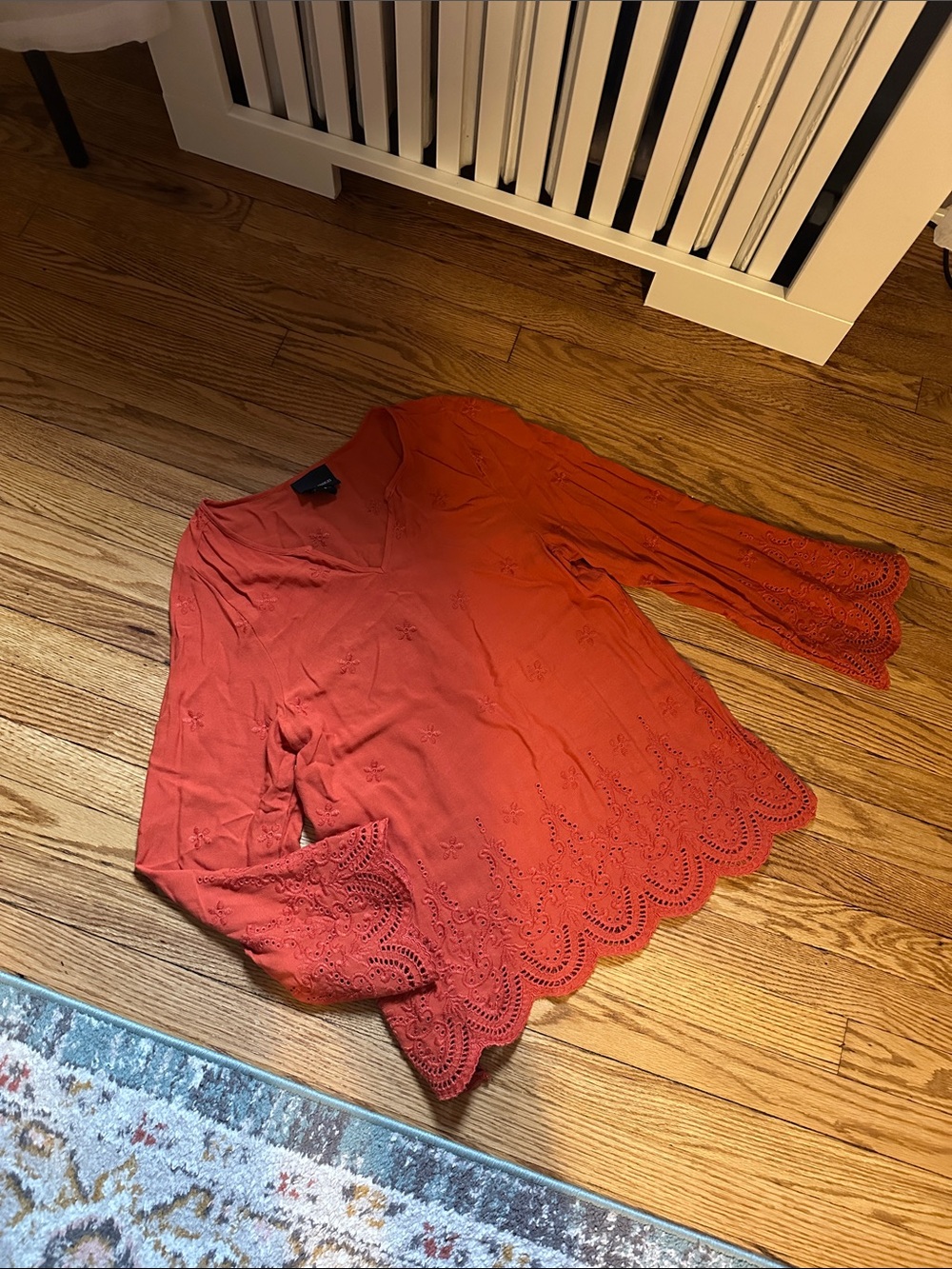 Women's Eyelet Hem V-Neck Blouse in Coral